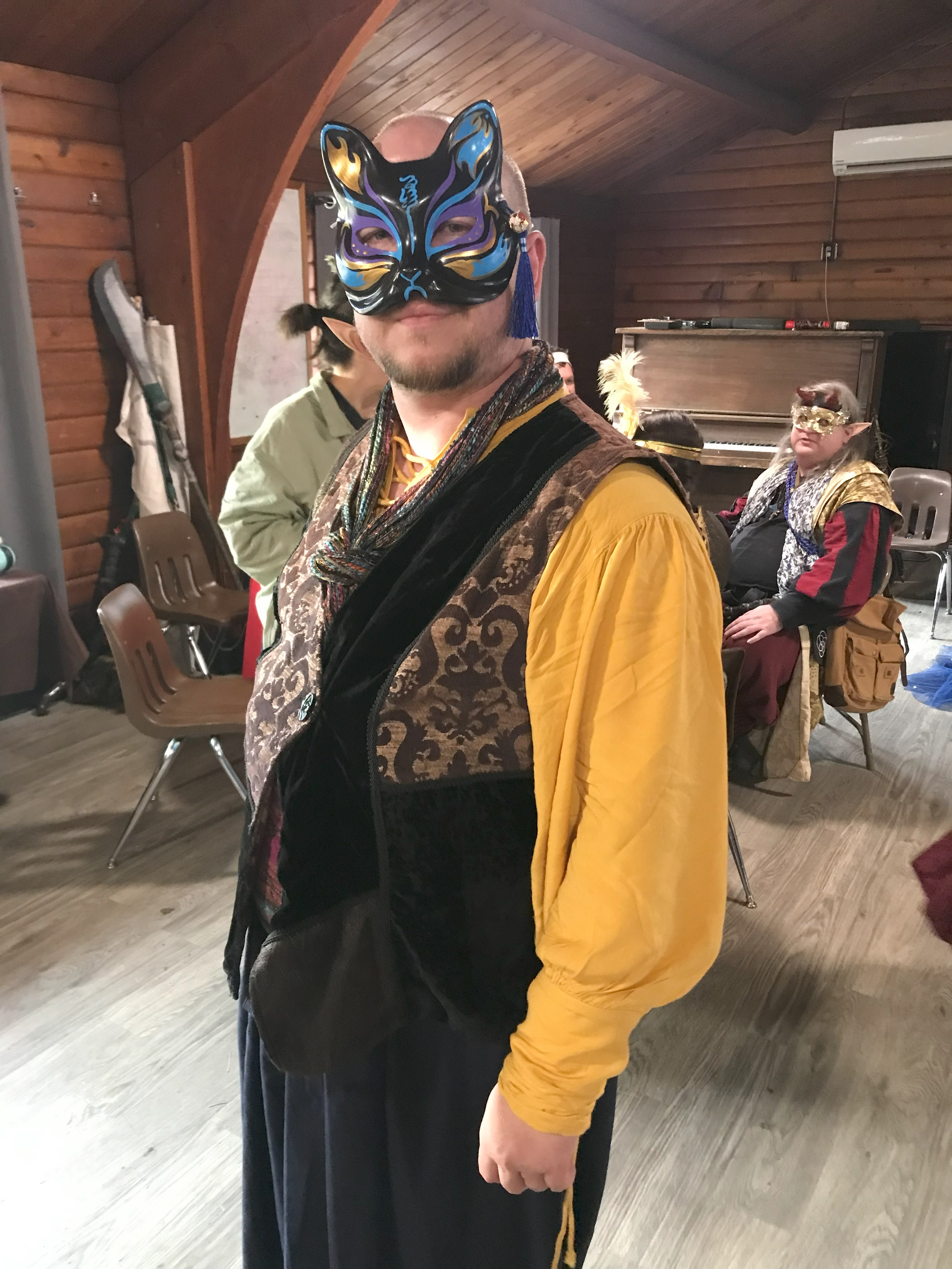 A stellarean in a mask looks at the camera, photo by Ryan W